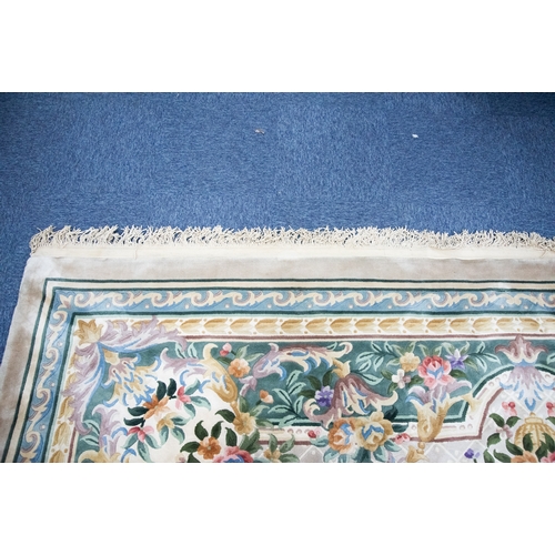 6 - LARGE WASHED CHINESE CARPET of Aubusson design, having large floral centre oval medallion, spandrels... 