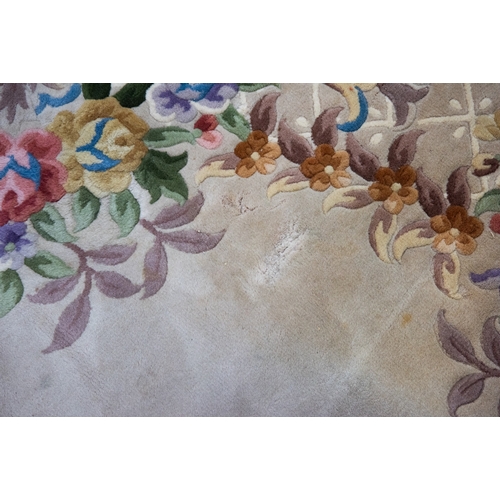 6 - LARGE WASHED CHINESE CARPET of Aubusson design, having large floral centre oval medallion, spandrels... 