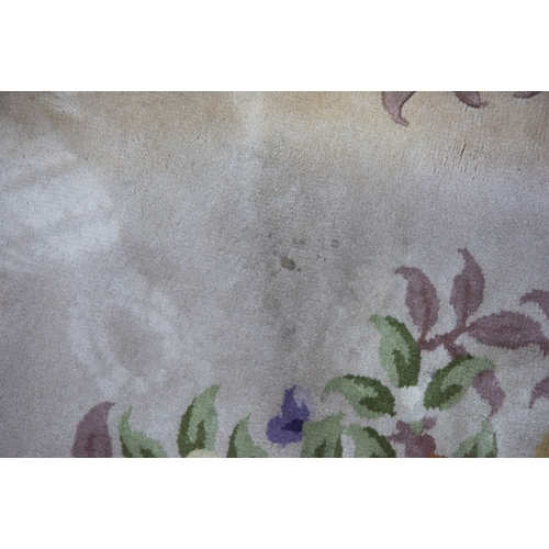 6 - LARGE WASHED CHINESE CARPET of Aubusson design, having large floral centre oval medallion, spandrels... 