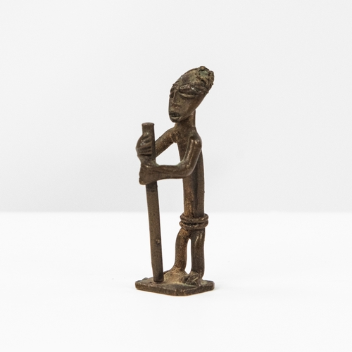 42 - ASHANTI AKAN BRONZE GOLD WEIGHT in the form of a man standing playing two tall drums, on oblong base... 