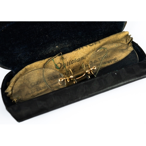 16 - PAIR OF FRAMELESS PINCE NEZ; and a CHARAMY GOLD PLATED AND ENGINE TURNED SMALL CIRCULAR POWDER COMPA... 