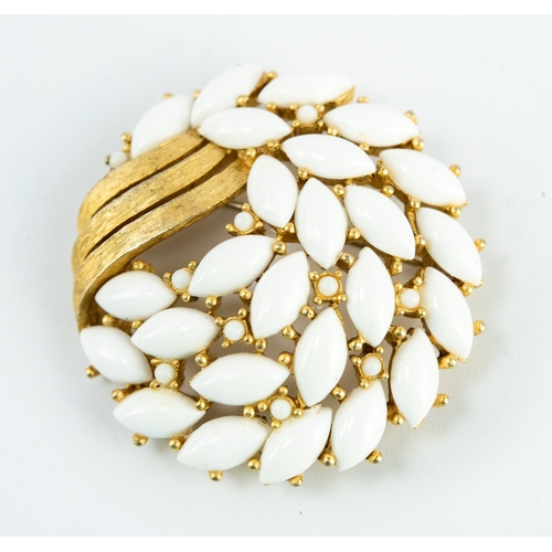 131 - TRIFARI GILT METAL AND WHITE LUCITE CIRCULAR BROOCH, signed, 1¾