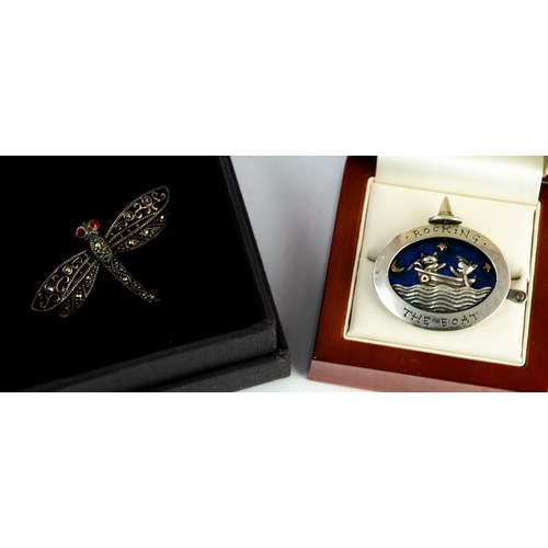 128 - SMALL SILVER AND MARCASITE DRAGONFLY BROOCH with faceted ruby eyes, 1¾