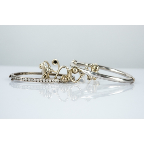 142 - STERLING SILVER WAVE DESIGN CUFF with beads, silver and channel set cubic zirconia hinged bangle, an... 