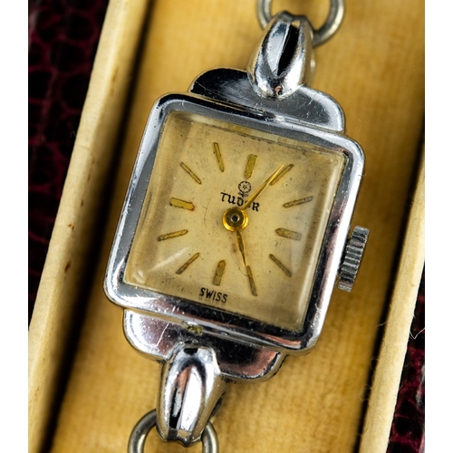 14 - LADY'S ROLEX TUDOR SWISS WRIST WATCH with mechanical movement, small square silvered dial with baton...