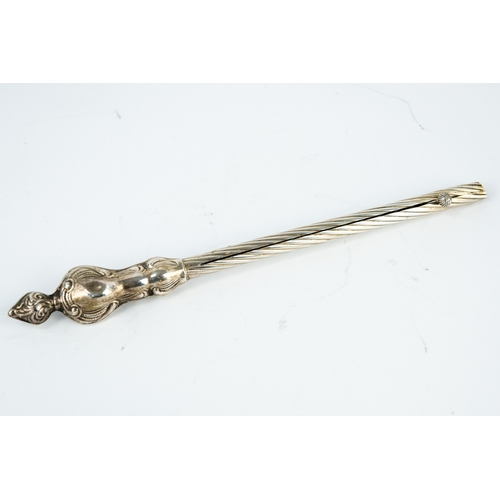166 - JUDAICA EMBOSSED SILVER COLOURED METAL TAPER HOLDER, of spiral fluted form with fancy filled handle ... 