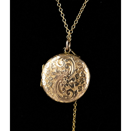 140A - GOLD COLOURED METAL CIRCULAR LOCKET PENDANT, all-over foliate scroll engraved, 4.9gms, and a gold-pl... 