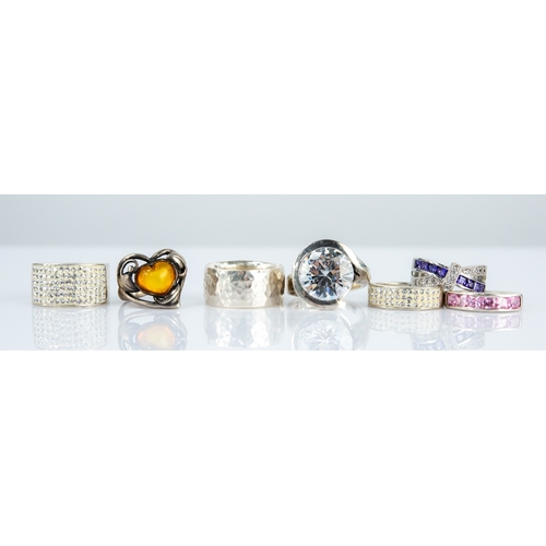 SILVER BROAD BAND RING with planished decoration and 6 SILVER AND PASTE ...