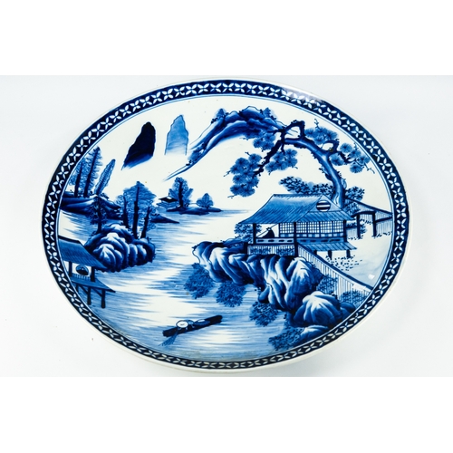 66 - JAPANESE LATE MEIJI PERIOD BLUE AND WHITE PORCELAIN PLAQUE, of typical form, painted with figures, d... 