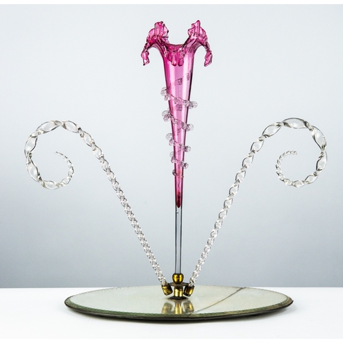 76 - VICTORIAN CRANBERRY AND CLEAR GLASS TABLE CENTRE EPERGNE, the oval mirrored base with central gilt m... 
