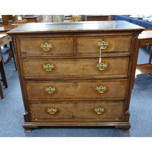 78 - GEORGE III OAK AND MAHOGANY CROSSBANDED CHEST OF DRAWERS, the oblong top above two short and three l... 