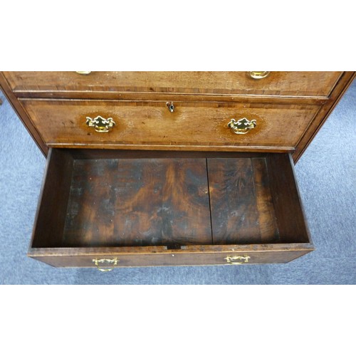 78 - GEORGE III OAK AND MAHOGANY CROSSBANDED CHEST OF DRAWERS, the oblong top above two short and three l... 