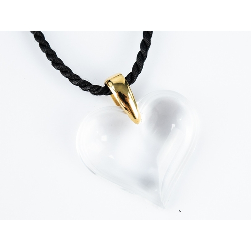 129 - LALIQUE CRYSTAL HEART SHAPED PENDANT, engraved signature and named on the gold plated bale, on a bla... 
