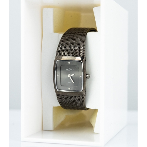 57 - LADY'S SKAGEN QUARTZ WRIST WATCH with steel case, rectangular dial with batons, multi strand metal b... 