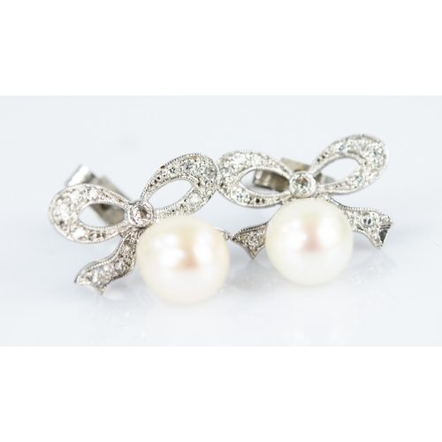 165 - PAIR OF 9ct WHITE GOLD TINY DIAMOND SET EARRINGS for pierced ears, ribbon bow pattern with tear shap... 