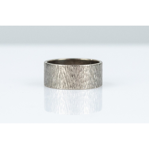 125 - 18ct WHITE GOLD BARK TEXTURED BROAD WEDDING RING, 7.2gms, ring size 'M/N'