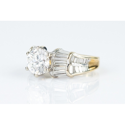 124 - 18ct GOLD RING set with a round brilliant cut solitaire diamond in a raised eight claw setting, the ... 