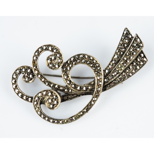 143 - SILVER AND MARCASITE TRIPLE STRAND SCROLL BROOCH