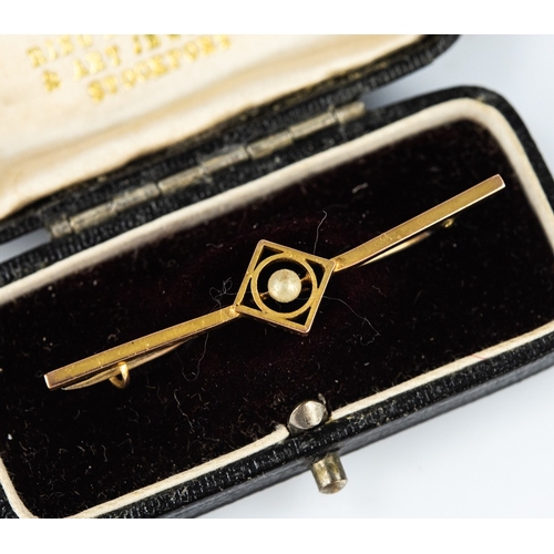 142 - 9ct GOLD BAR BROOCH, the rectangular openwork centre set with a small pearl, in case, 1.4gms
