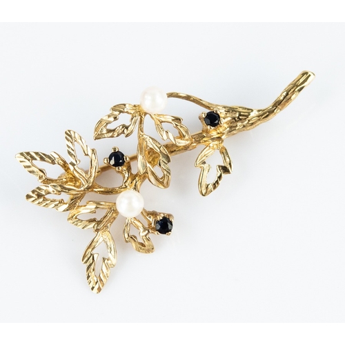 140 - GOLD FOLIATE SPRAY BROOCH set with two pearls and three small garnets, 4gms (tests 9ct)