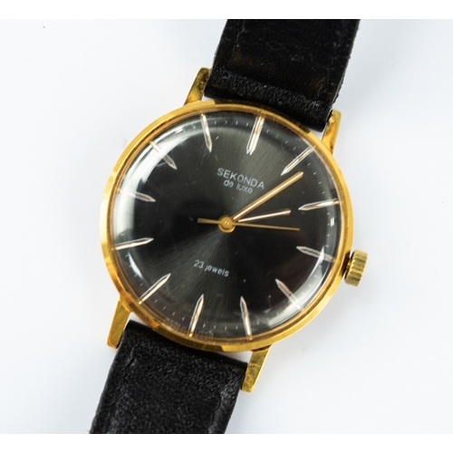 24 - GENT'S SEKONDA DE LUXE RUSSIAN GOLD PLATED WRIST WATCH, with 23 jewels movement, circular black dial... 