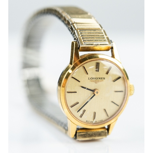 35 - LADY'S LONGINES SWISS GOLD PLATED WRIST WATCH with mechanical movement, the circular silvered dial w... 
