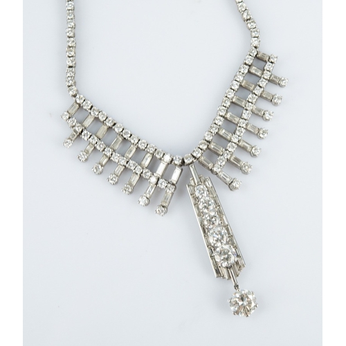 119 - ART DECO PLATINUM AND DIAMOND NECKLACE, the chain back with each link claw set with a small round br... 