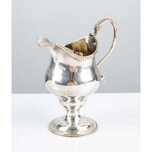 174 - GEORGE III SILVER PEDESTAL CREAM JUG with beaded border, beaded 'S' scroll handle, on stem on domed ... 