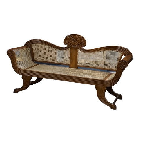 93 - ANGLO-CEYLONESE REGENCY-STYLE BERGERE SETTEE, the upright scroll back panels, the outscroll arms all... 