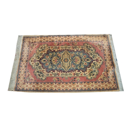 3 - TURKISH MACHINE WOVEN RUG with large concentric centre medallion, pale blue and off white on a pink ... 