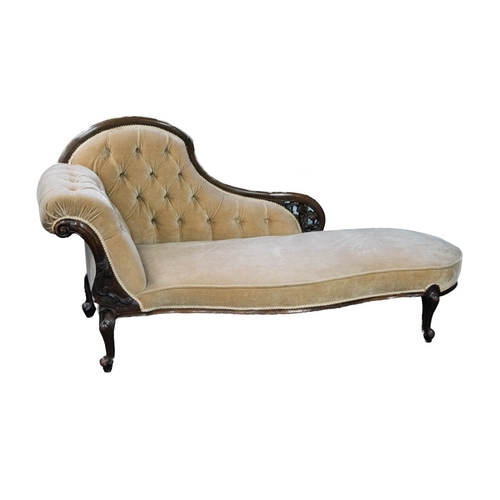 91 - VICTORIAN CARVED AND PIERCED WALNUT CHAISE LONGUE, the deep buttoned and moulded back with leaf pier... 