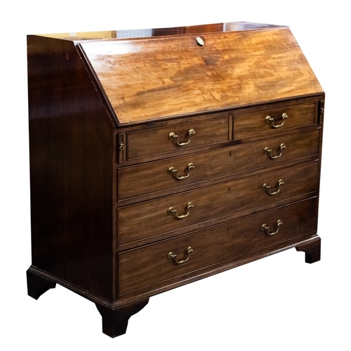 83 - GEORGE III MAHOGANY LARGE BUREAU, of typical form, the inter fitted with pigeon holes and drawers ar... 
