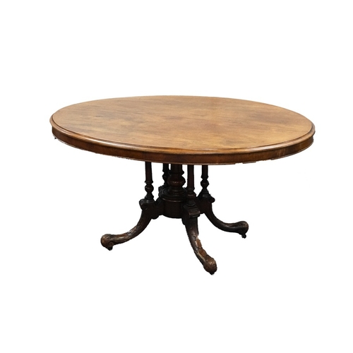 82 - VICTORIAN MAHOGANY BREAKFAST TABLE, the oval moulded tilt-top above a conforming frieze, set above f... 
