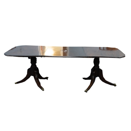 65 - EARLY NINETEENTH CENTURY MAHOGANY TWIN PEDESTAL DINING TABLE WITH ADDITIONAL LEAF, the moulded, roun... 
