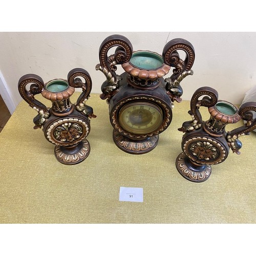 91 - Majolica clock garniture of Dolphin handed clock & vases - Damage to one of the handles and the bott... 