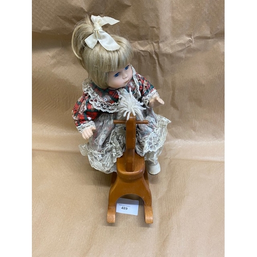 489 - Leonardo Collection china doll on a rocking horse - Section O5