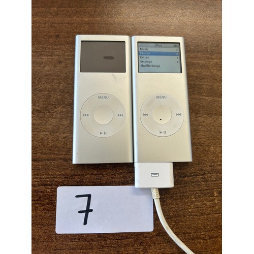 7 - 2x I pod shuffle - Haven't been tested not on charge charger wire included one with slight smudge on... 