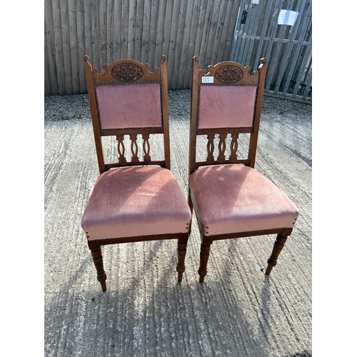 125 - Antique carved wood asset chairs  with pink velvet (x2)