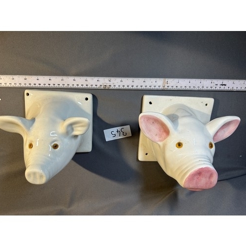 345 - Pair of pig head ceramic apron hangers