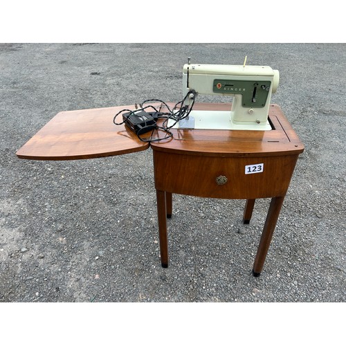 123 - Singer sewing machine in table