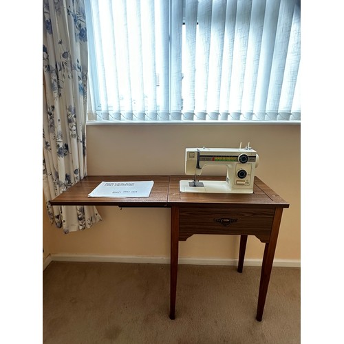 405 - Sewing machine in table