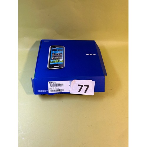 77 - Nokia phone with accessories: micro SD card (new) and Ipod - all untested.