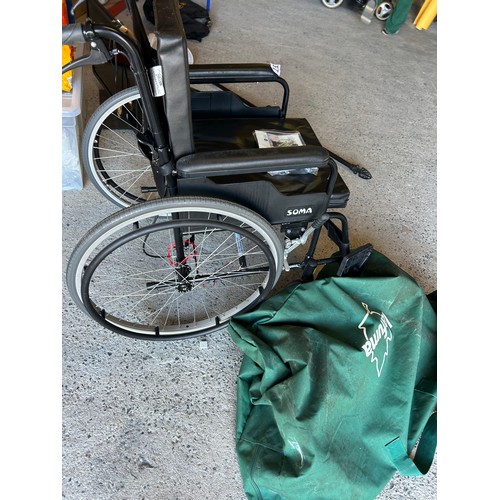 151 - Self propelled folding wheelchair with cushions, folding footplates and heel strap.