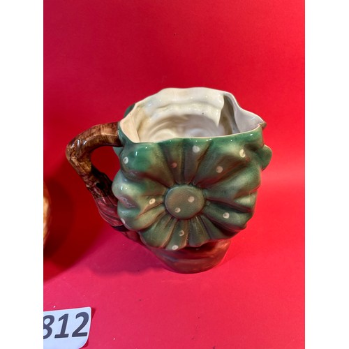 812 - Ceramic character jug and vase