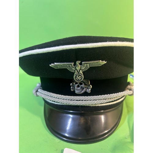 267 - Replica German peaked cap and book