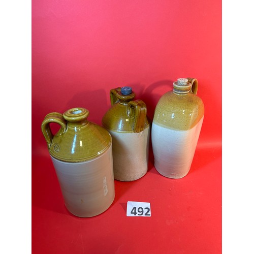 492 - 3 x stoneware flagons with handles - 33cms tall approx.