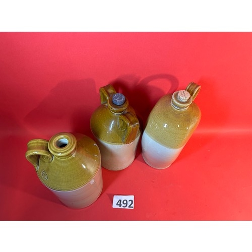 492 - 3 x stoneware flagons with handles - 33cms tall approx.