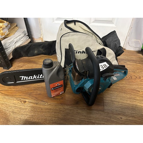 138 - Makita chainsaw & oil with bag