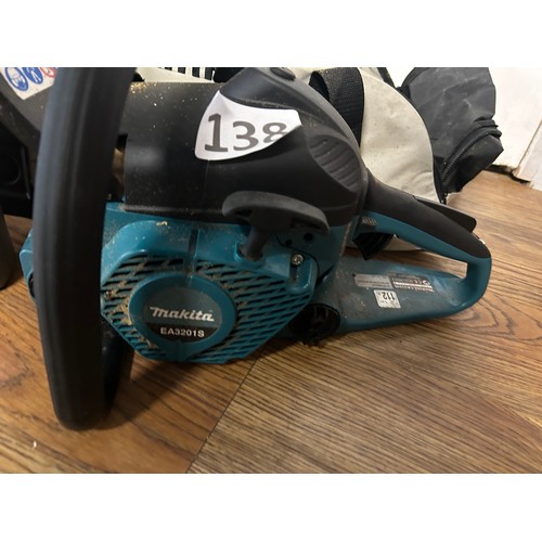 138 - Makita chainsaw & oil with bag