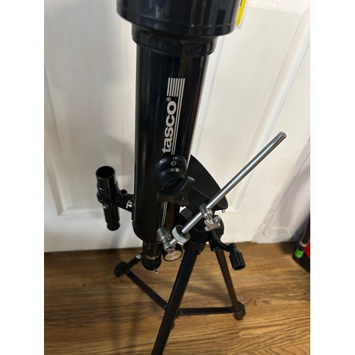 139 - Tasco telescope and tripod stand